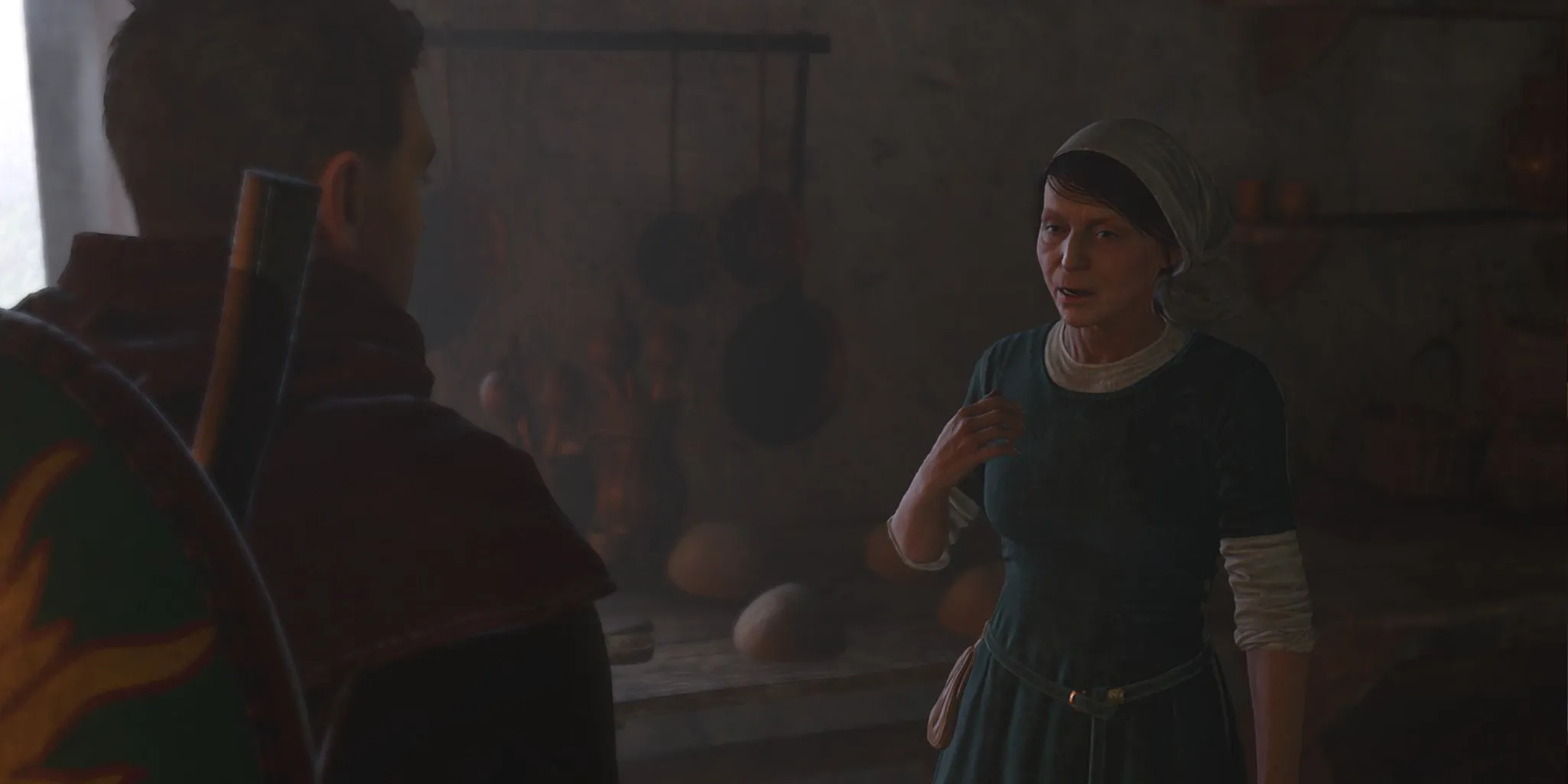 Bertha, một người dân trong Lâu đài Trosky, đang nói chuyện với Henry về ma quỷ trong Kingdom Come Deliverance 2