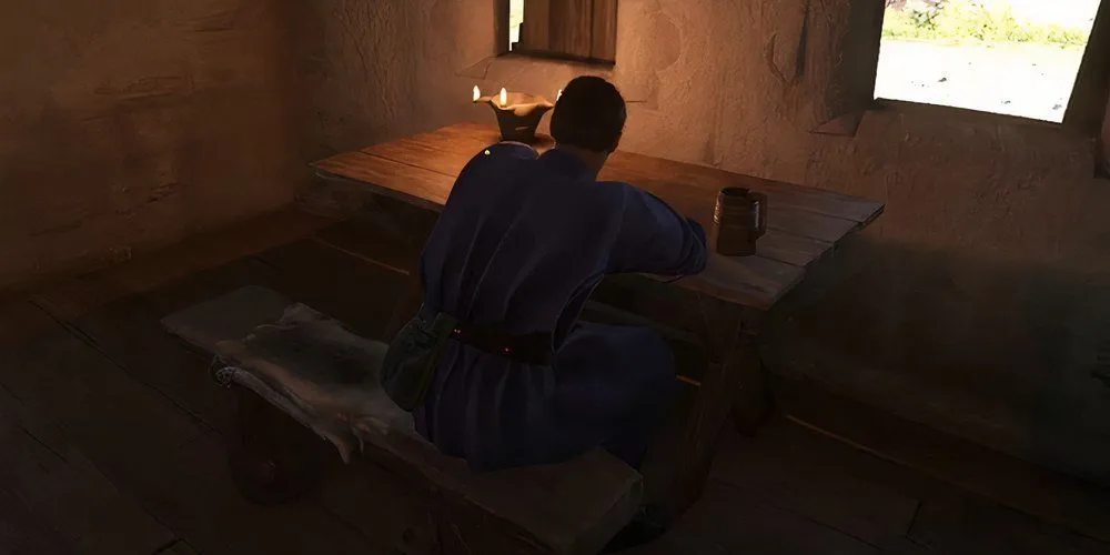 Chernik ngồi trong quán rượu ở Bylany cung cấp thông tin về Mikush trong Kingdom Come Deliverance 2