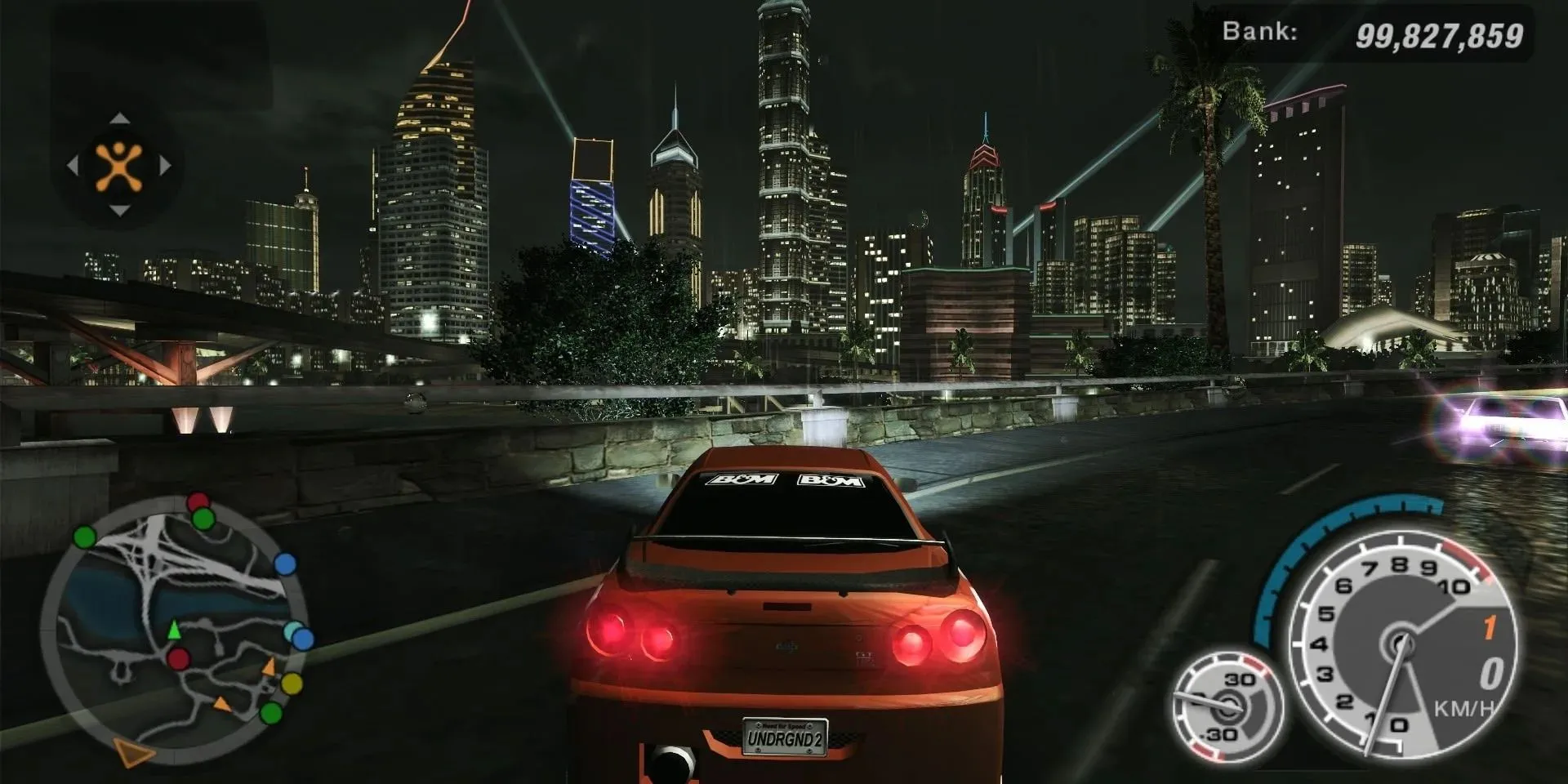 Chiếc Nissan Skyline độ trong Need For Speed Underground 2 đang lướt trên đường phố ban đêm