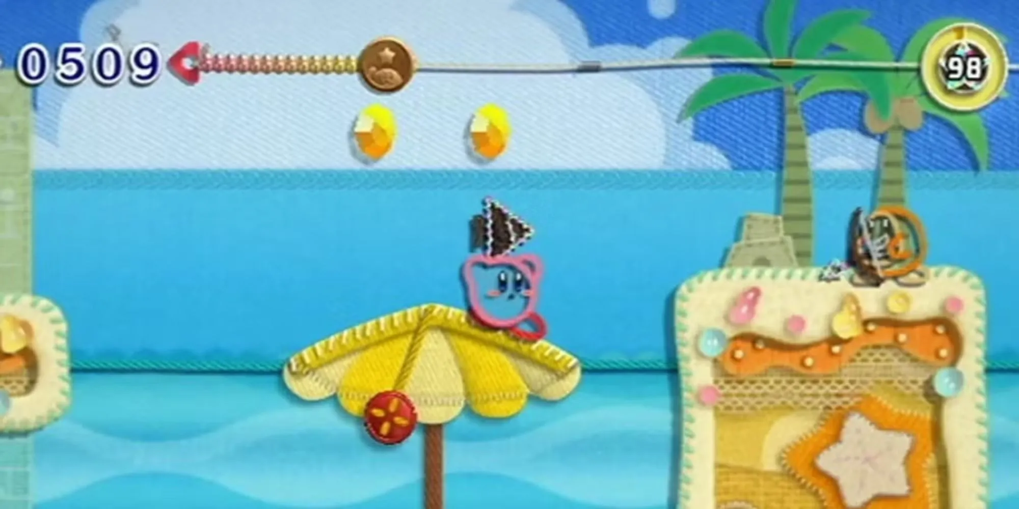 Kirby nhắm bắn một Archer Waddle Dee trong game Kirby's Epic Yarn