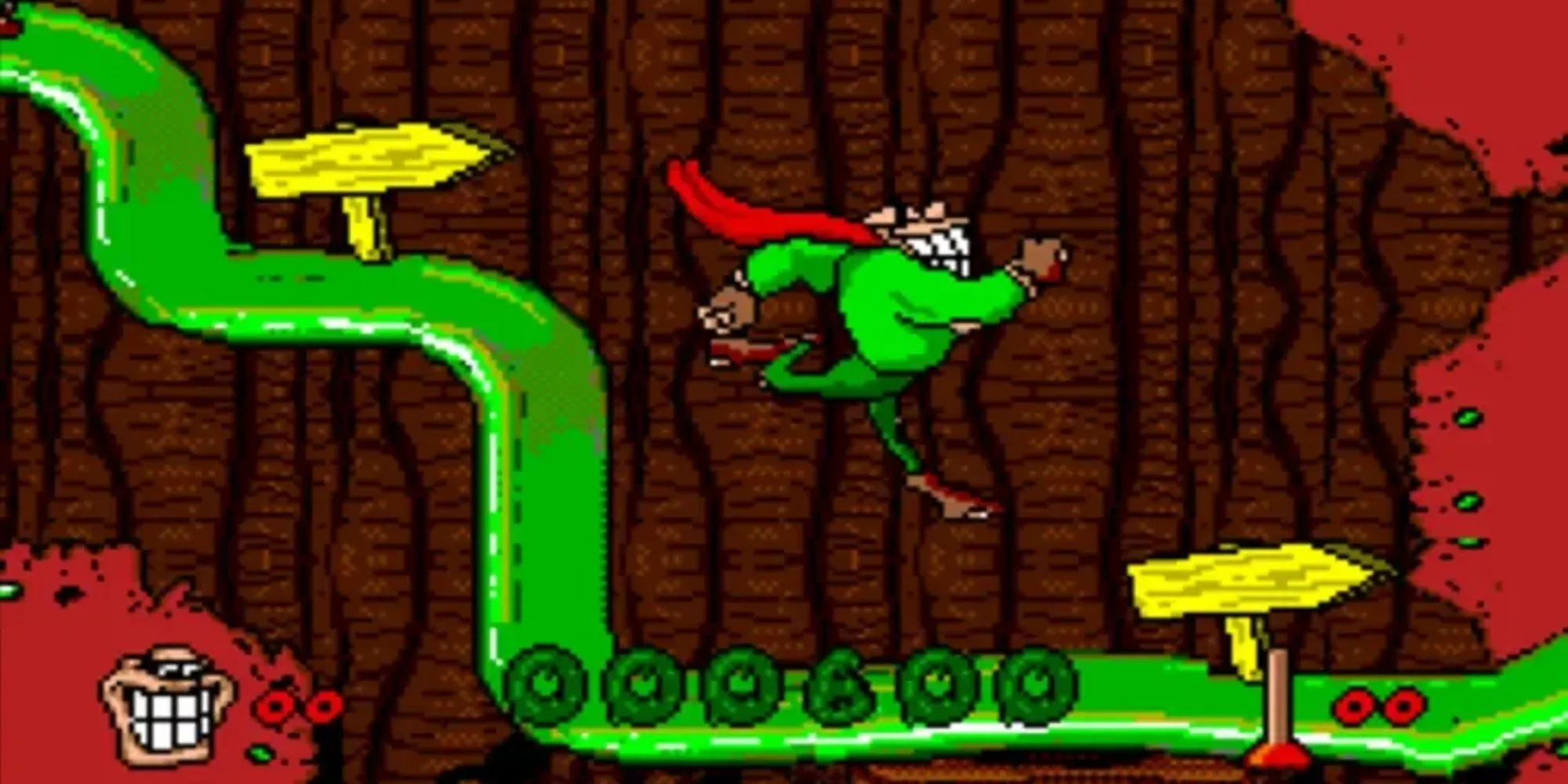 Nhân vật Boogerman và hình ảnh gameplay game Boogerman A Pick and Flick Adventure trên SNES