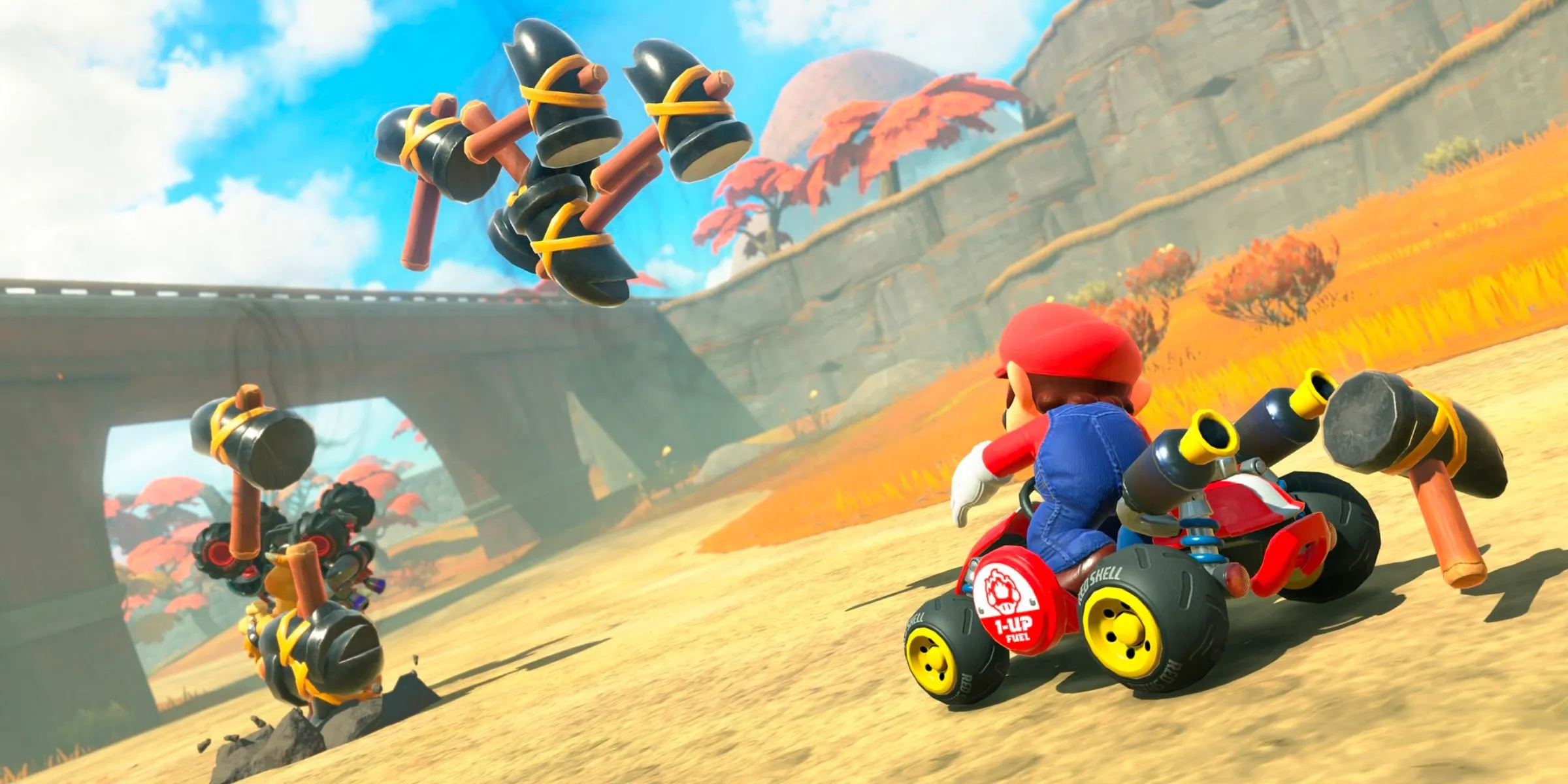 Mario sử dụng vật phẩm Búa để tấn công Bowser trong Mario Kart World